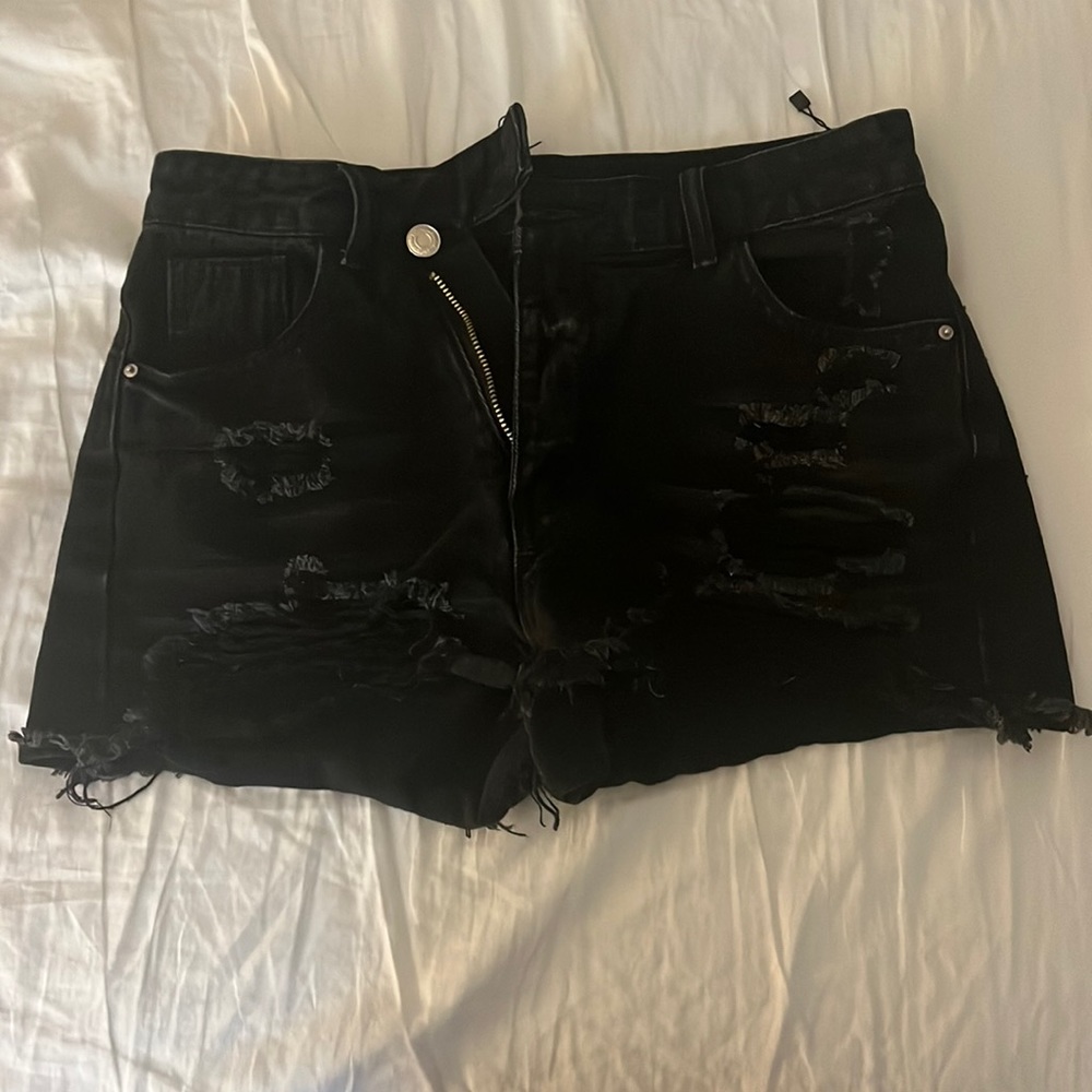 very ripped black jean shorts. US size 4. from shein